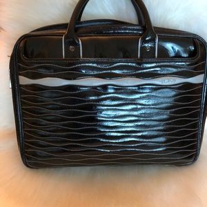 Tumi black, patent, quilted reef case